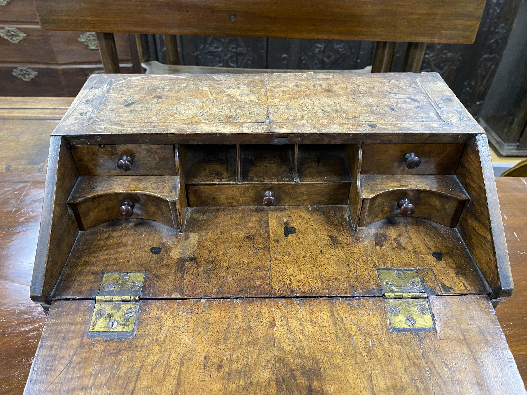 A small early 18th century feather banded walnut table-top bureau, width 40cm, depth 25cm, height 24cm, NB: From the Estate of Rt Hon Lord Lawson of Blaby